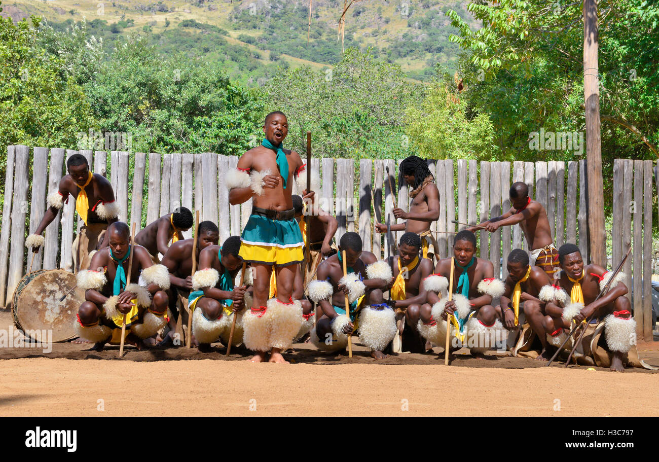 Swazi traditional troupe singing and dancing at the  Mantenga Swazi Cultural Village (Ligugu Lemaswati) Ezulwini Valley, Eswatini (formerly Swaziland) Stock Photo