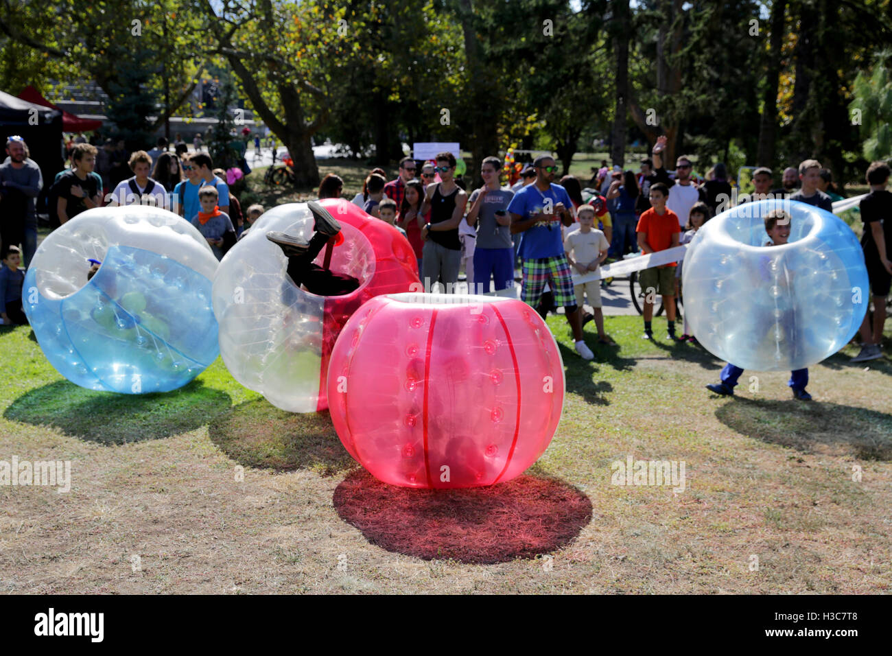 Sofia, Bulgaria - September 24, 2016: Boys are playing bubble football game in the park. Stock Photo