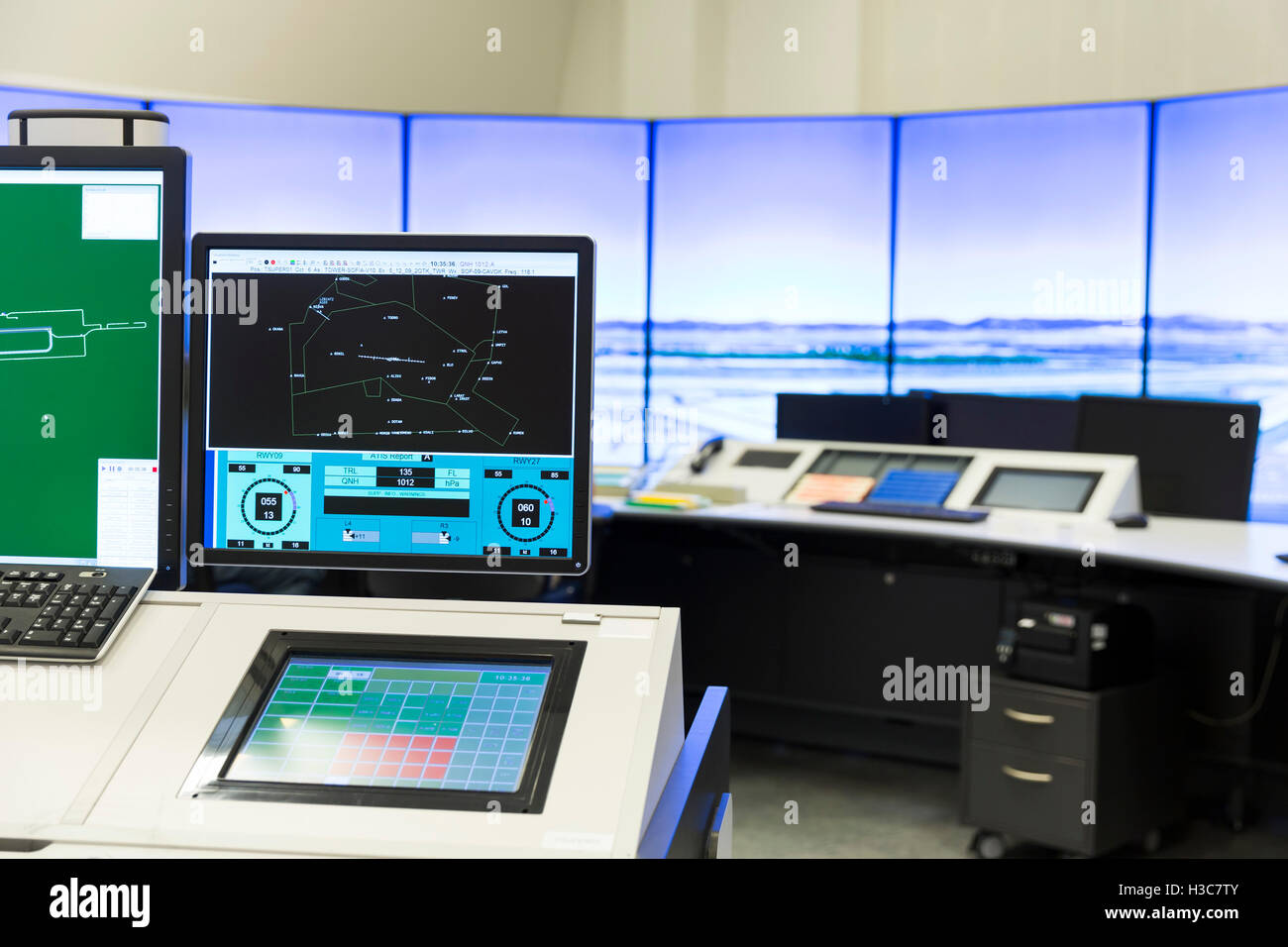 An air traffic controller is directing flights during a working day at