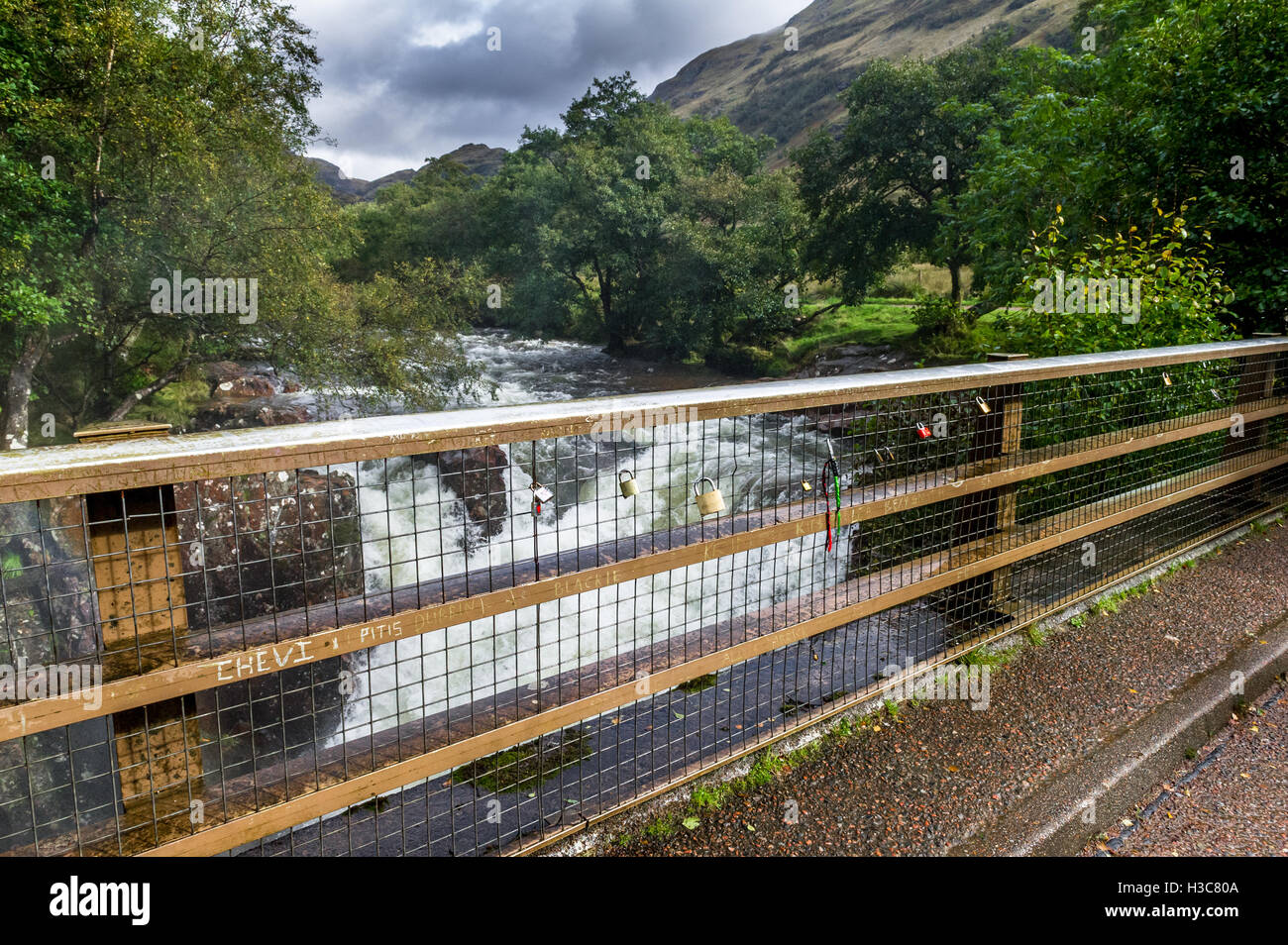 Love or friendship padlocks on the bridge metal railings which crosses