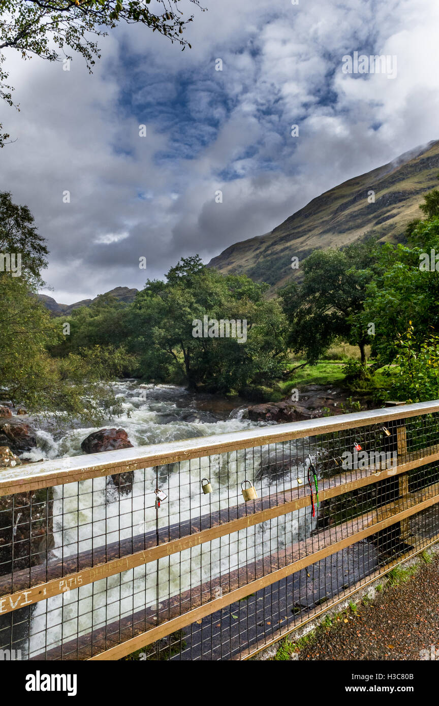 Love or friendship padlocks on the bridge metal railings which crosses