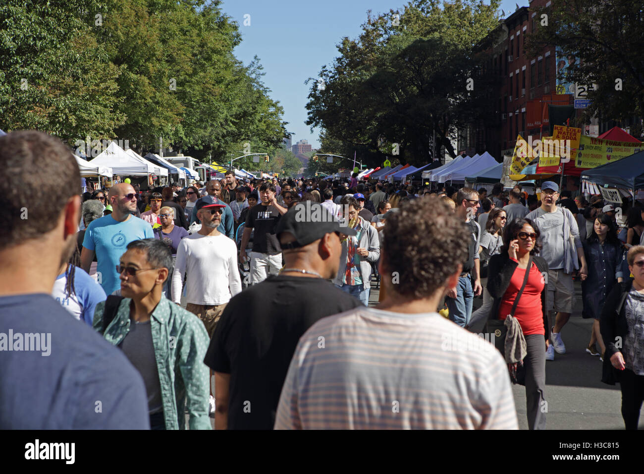 Large crowd of people attend the annual Atlantic Antic street fair held on the last Sunday of September in Brooklyn New York. At Stock Photo