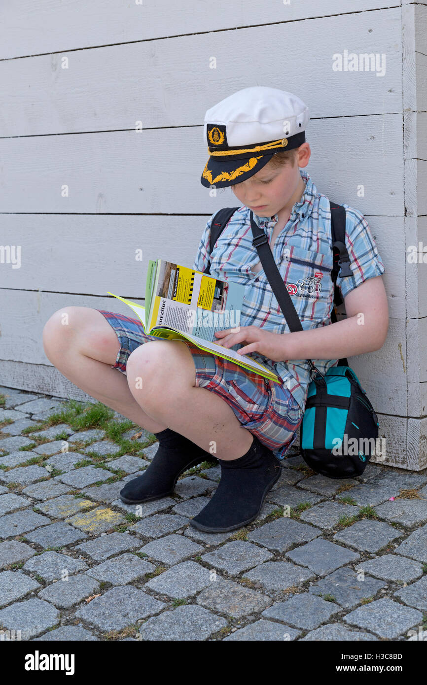 young boy reading a book Stock Photo
