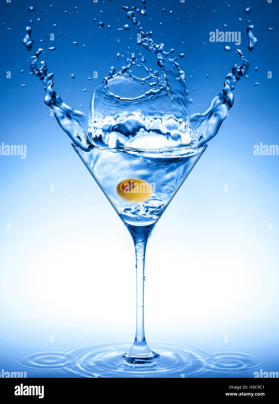 Martini glass with olive hires stock photography and images Alamy