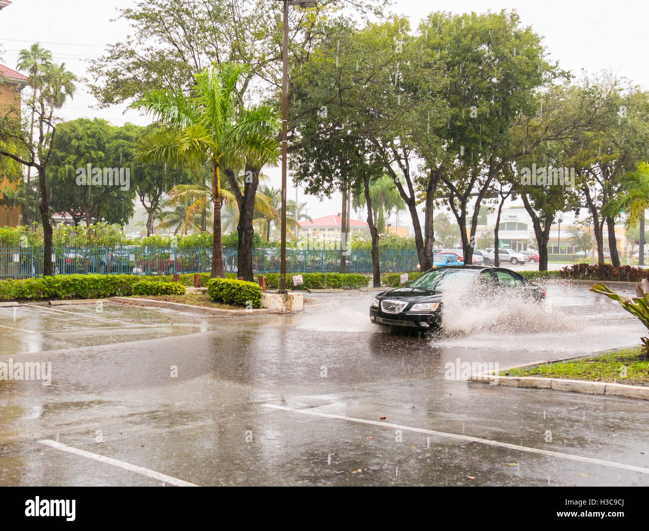 Car driving in heavy rainfall during tropical storm in Fort Lauderdale, Broward County, Florida, USA Stock Photo