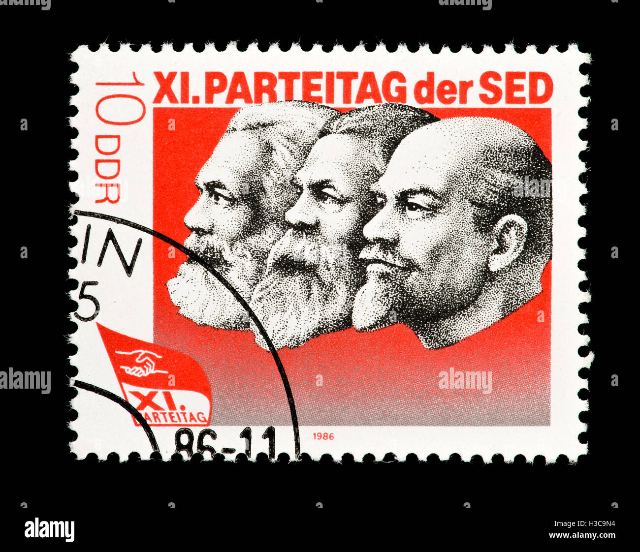 Postage stamp from East Germany depicting Karl Marx, Engels and Lenin, Socialist Unity 11th Party Day. Stock Photo