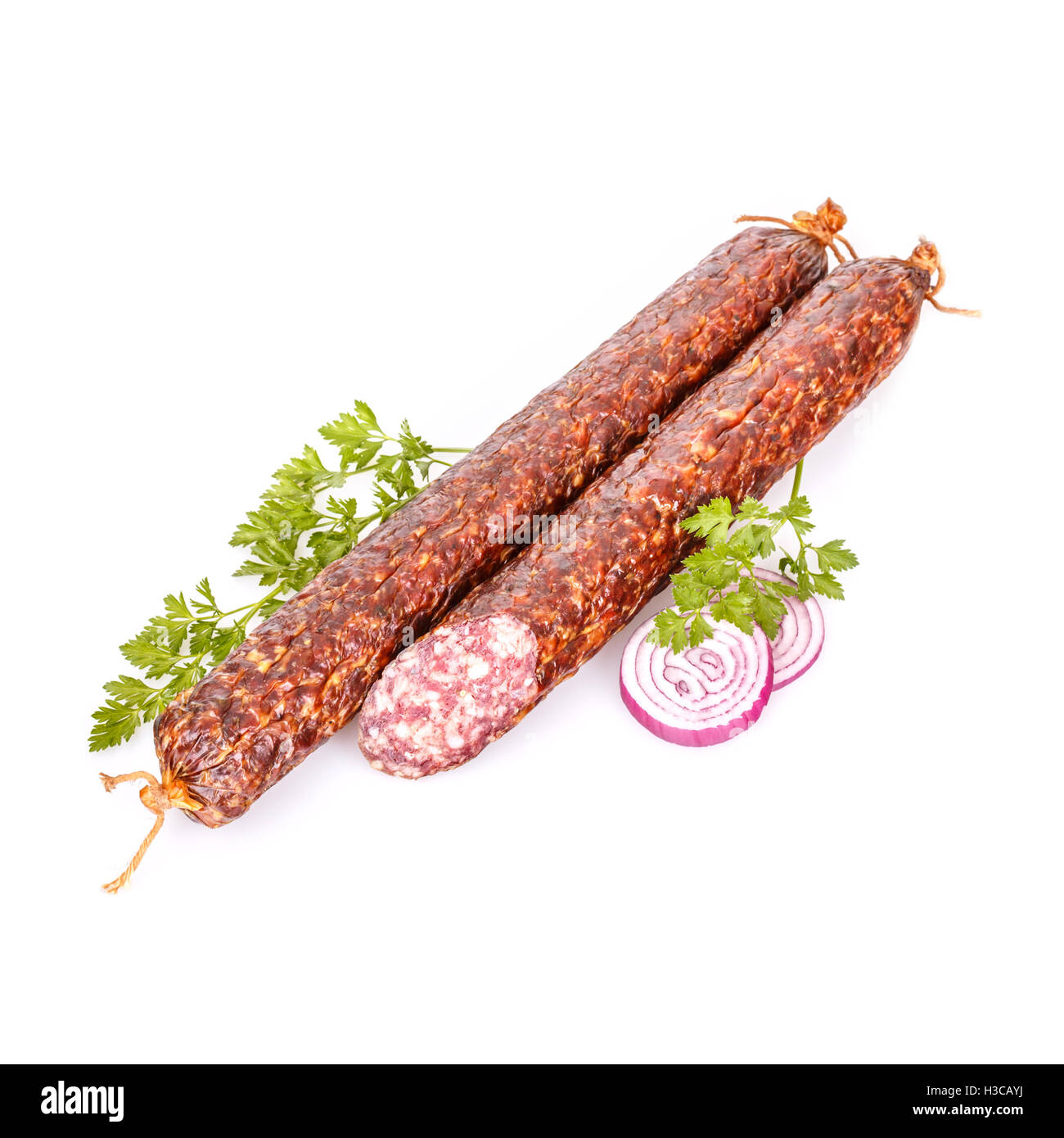Salami sticks on white background Stock Photo - Alamy