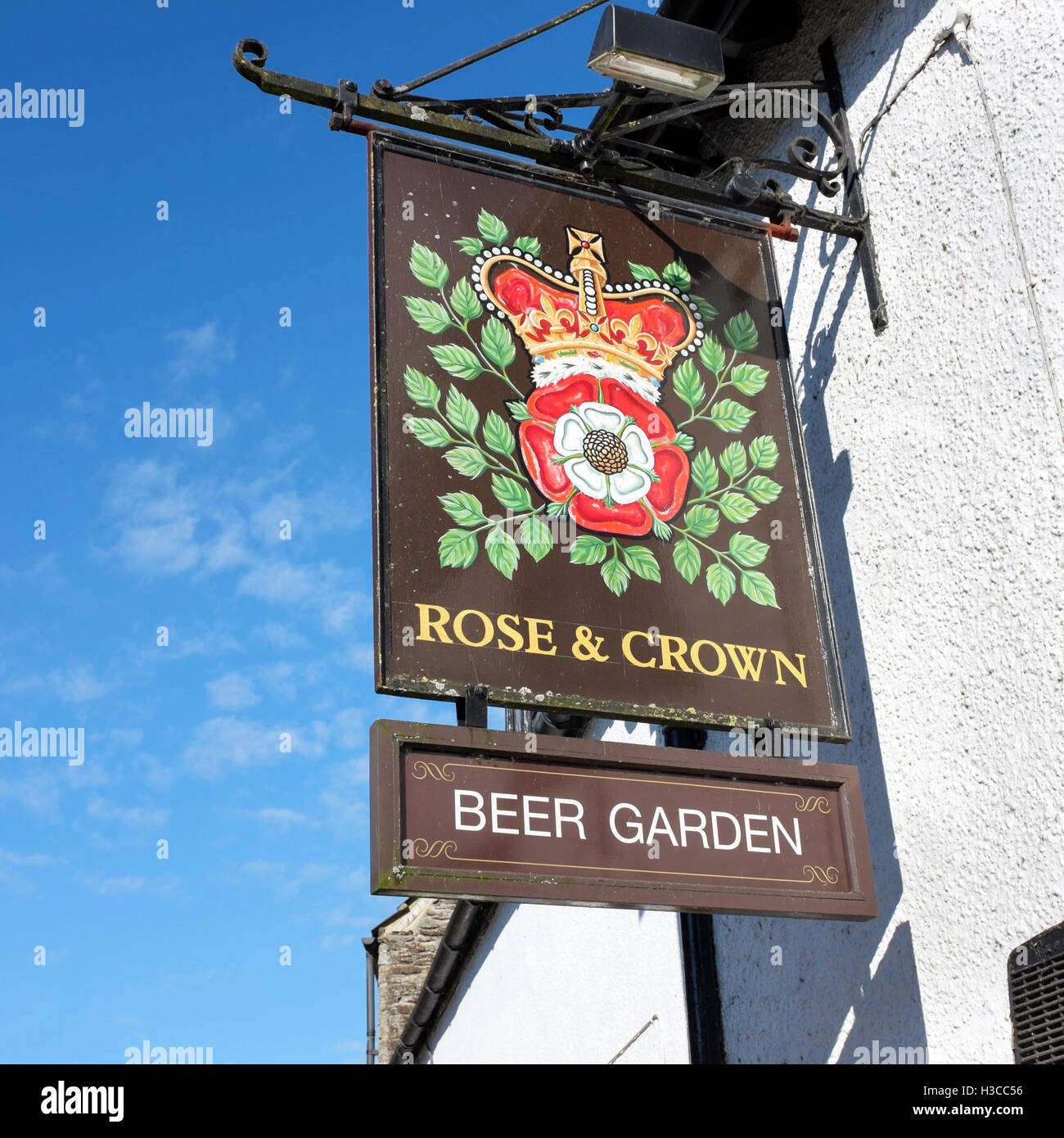 Traditional English hand painted Rose and Crown public house sign, Malmesbury, Wiltshire, England, UK Stock Photo