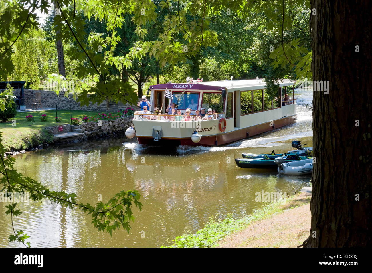 Canal barge used at a day tripper scenic boat tour on the River Rance Brittany France Stock Photo