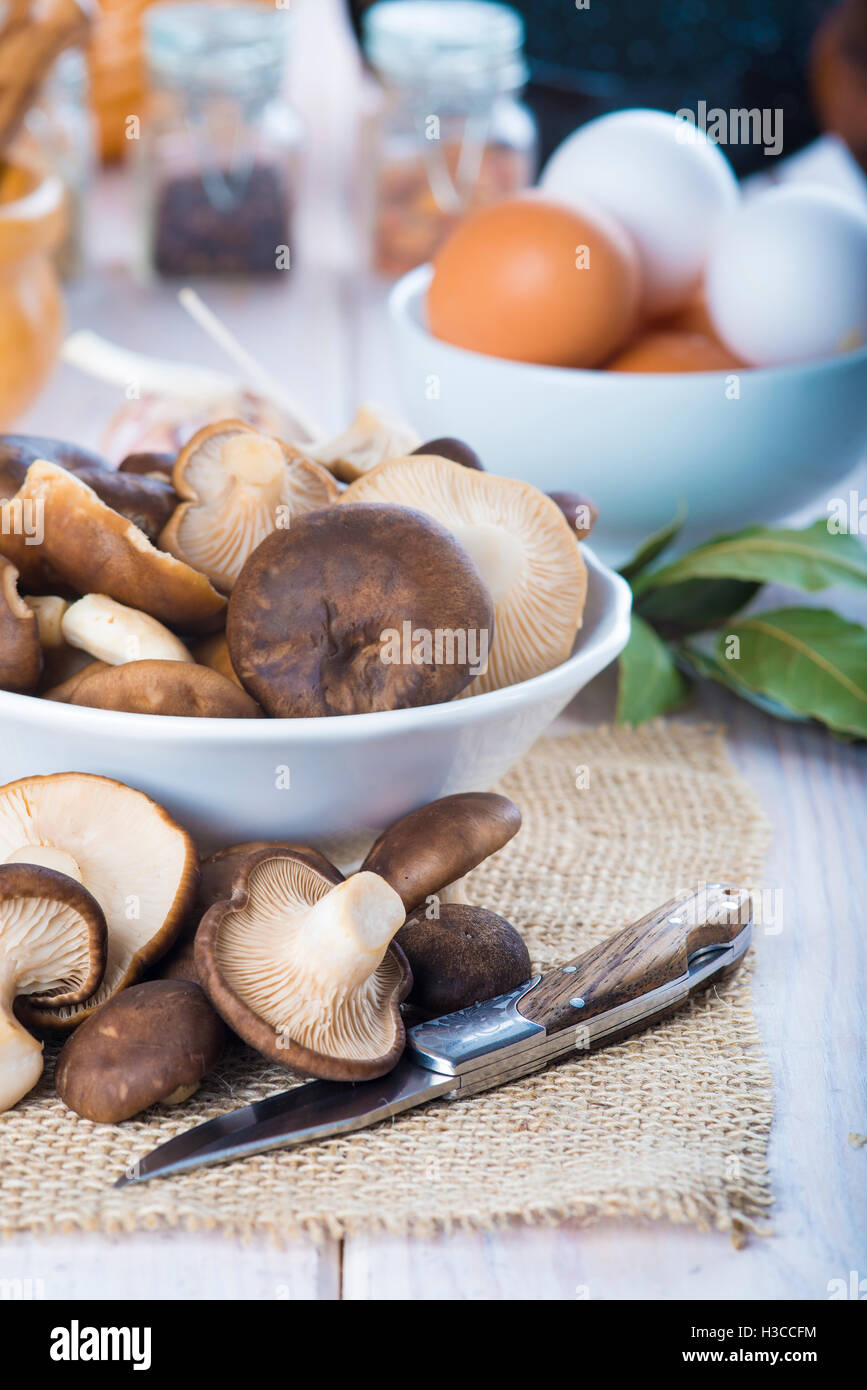 King trumpet mushrooms and ingredients for cooking on the table of the