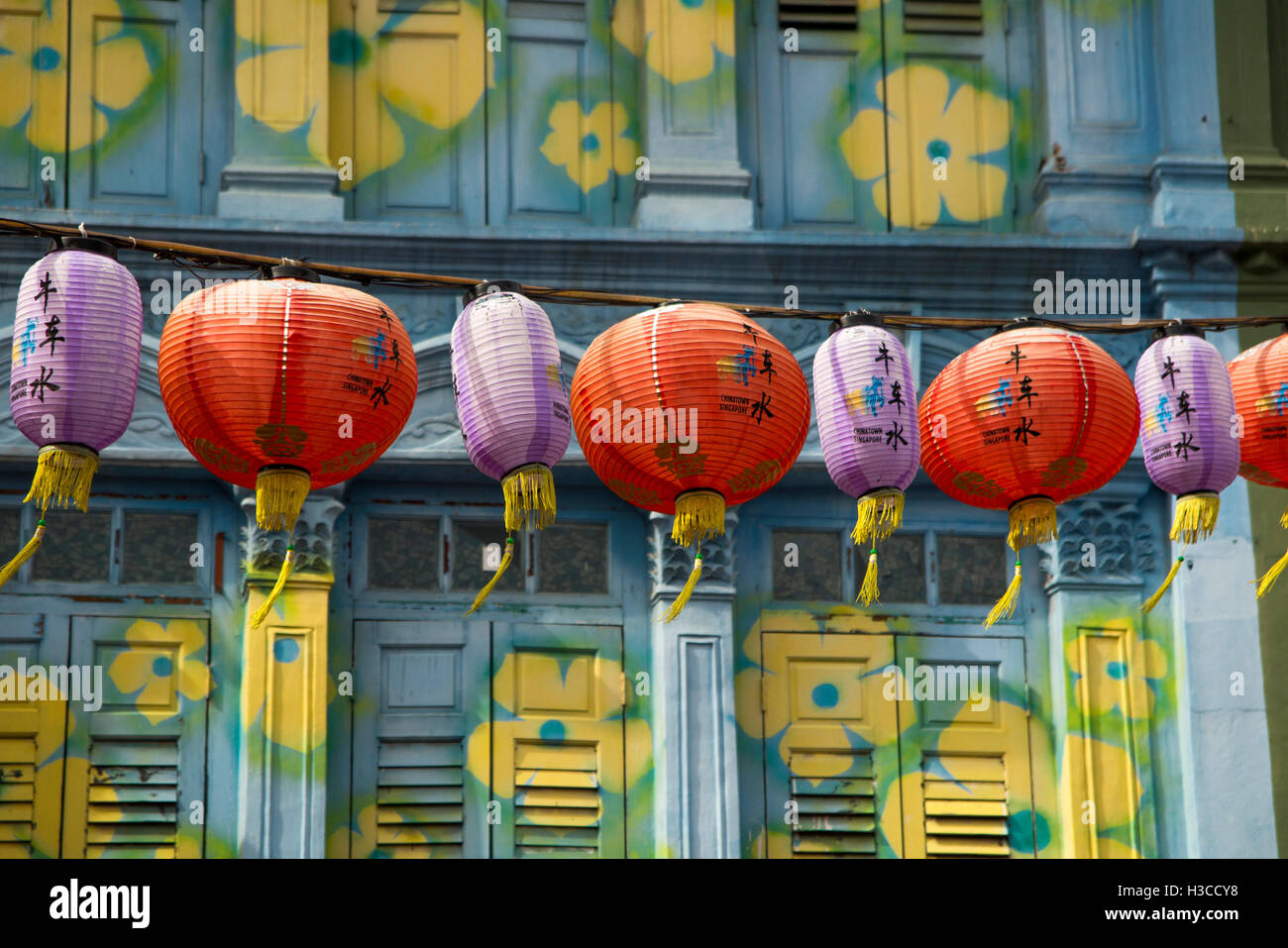 Singapore, Chinatown, Pagoda Street, Chinese lantern decoration and colourfully painted shophouse shutters Stock Photo