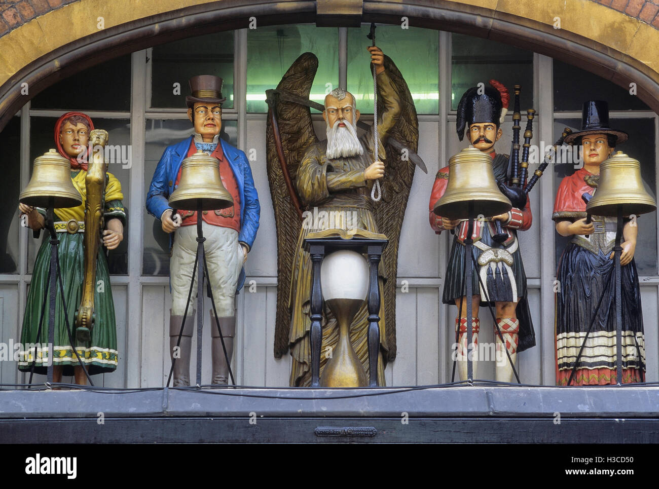 The figures of Baker’s Clock, above the Edwardian shopfront of GA Baker & Son, in Southgate Street, Gloucester. England. UK Stock Photo