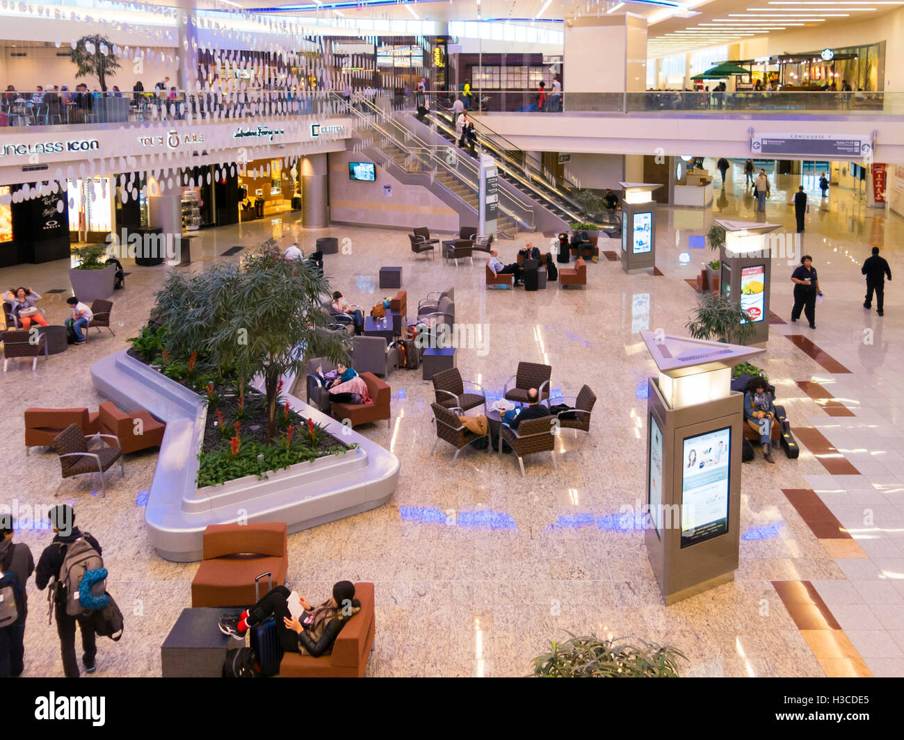 People, shops and restaurants in Maynard H Jackson Jr terminal on Hartsfield Jackson International airport in Atlanta, Georgia, Stock Photo