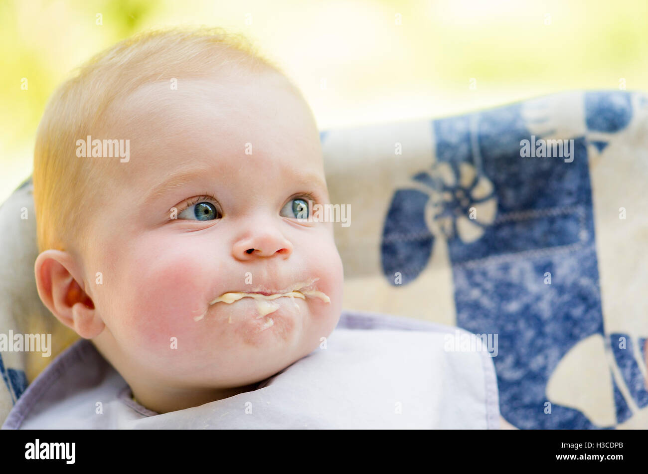 Messy baby eating, portrait Stock Photo