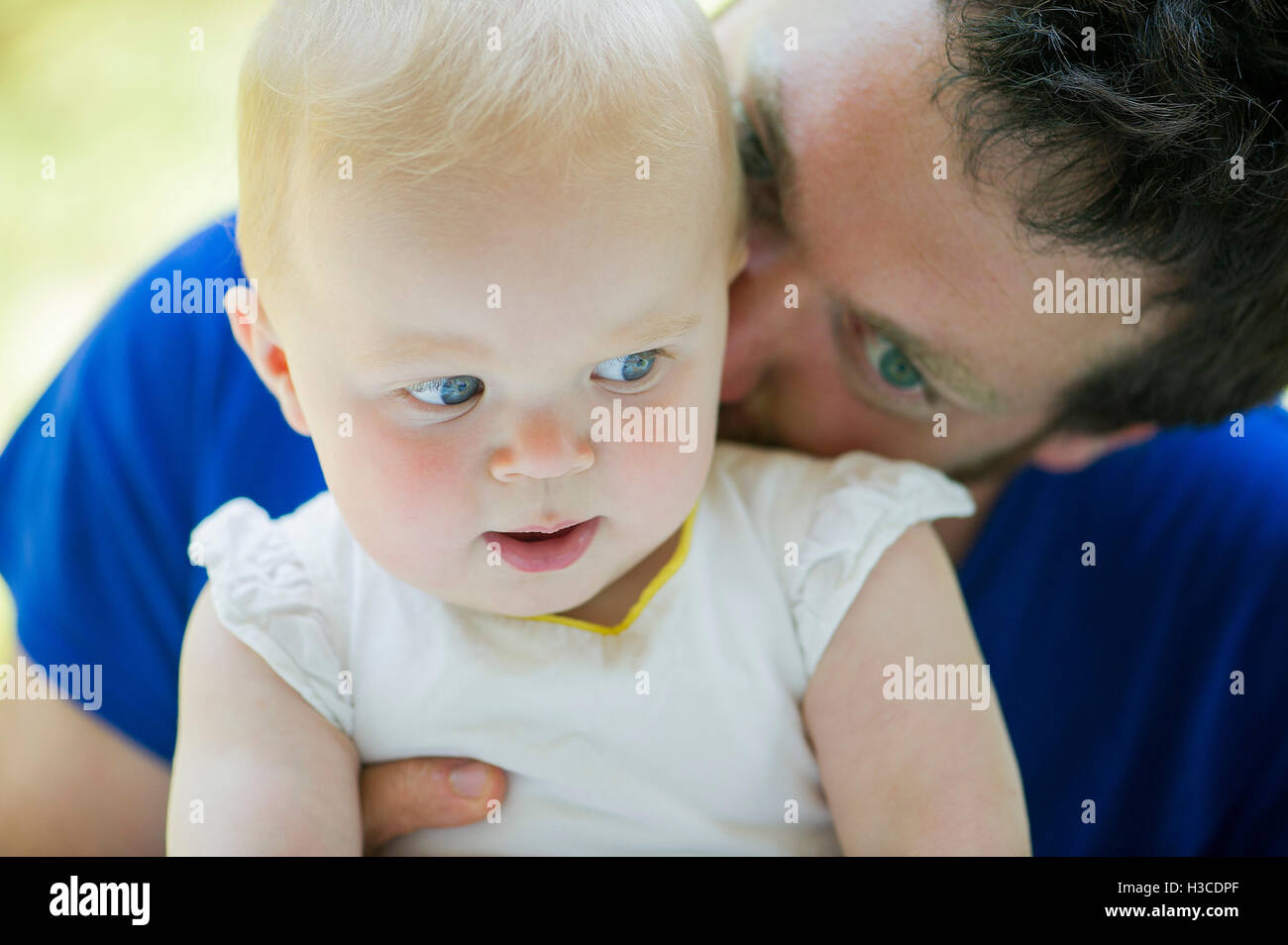 Father nuzzling baby Stock Photo
