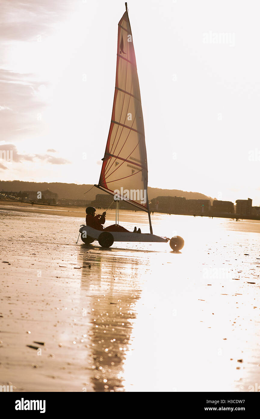 Person land sailing at the beach Stock Photo
