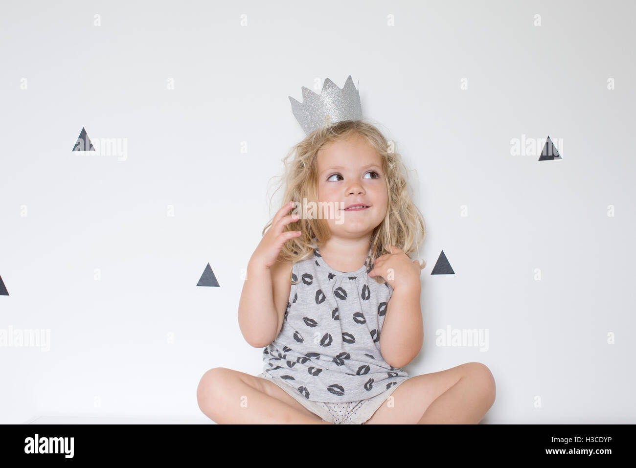 Little girl wearing paper crown Stock Photo