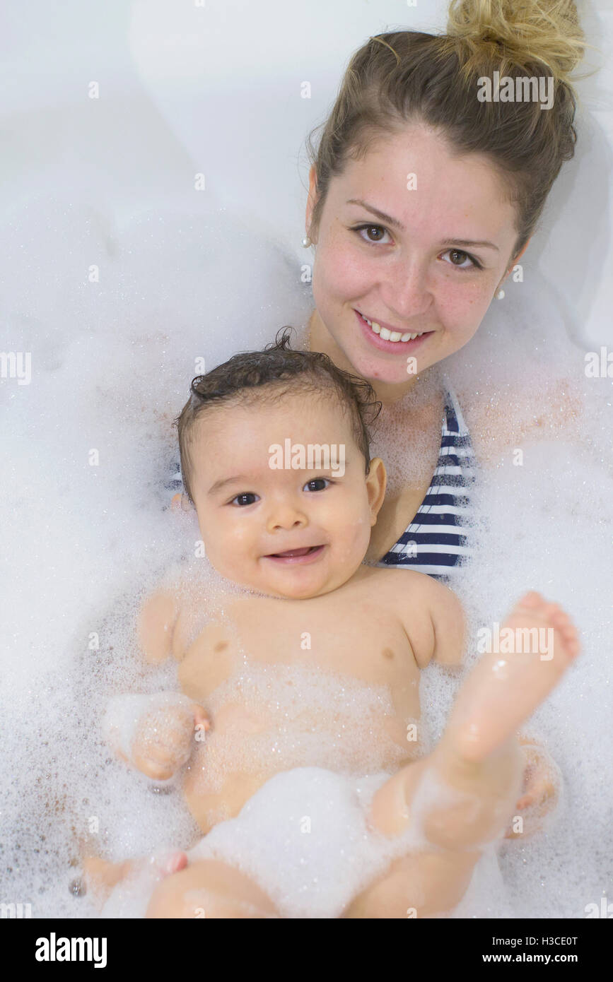 Mother and baby taking a bubble bath together Stock Photo Alamy
