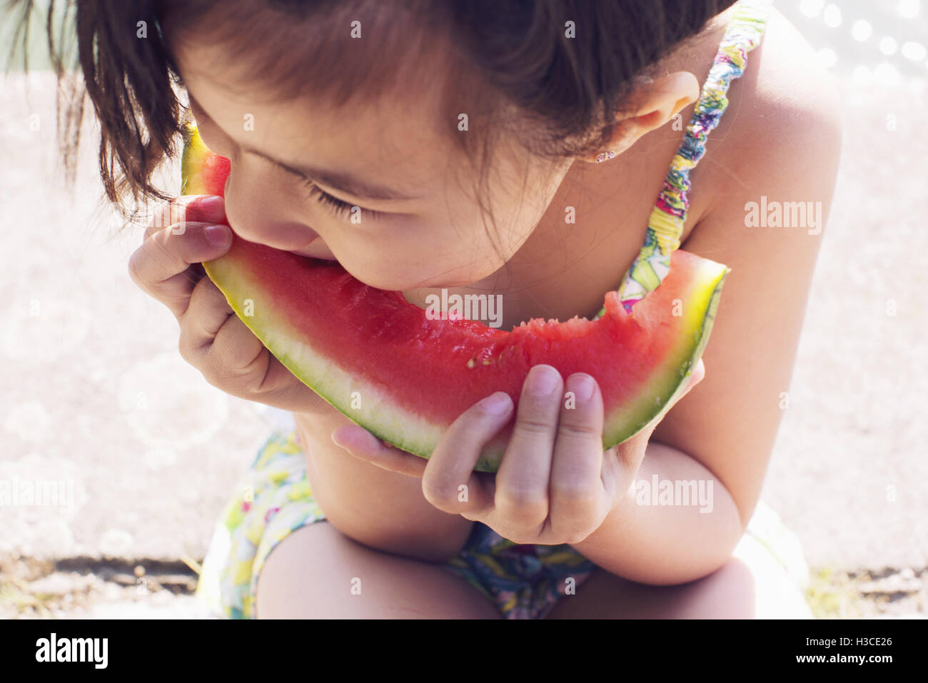 Girl eating watermelon, close-up Stock Photo