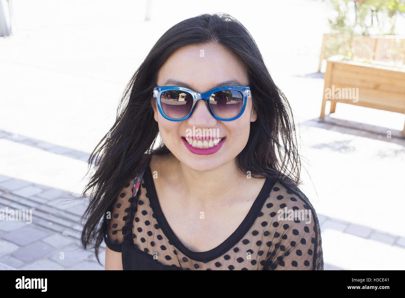 Long haired woman in sunglasses hi-res stock photography and images - Alamy