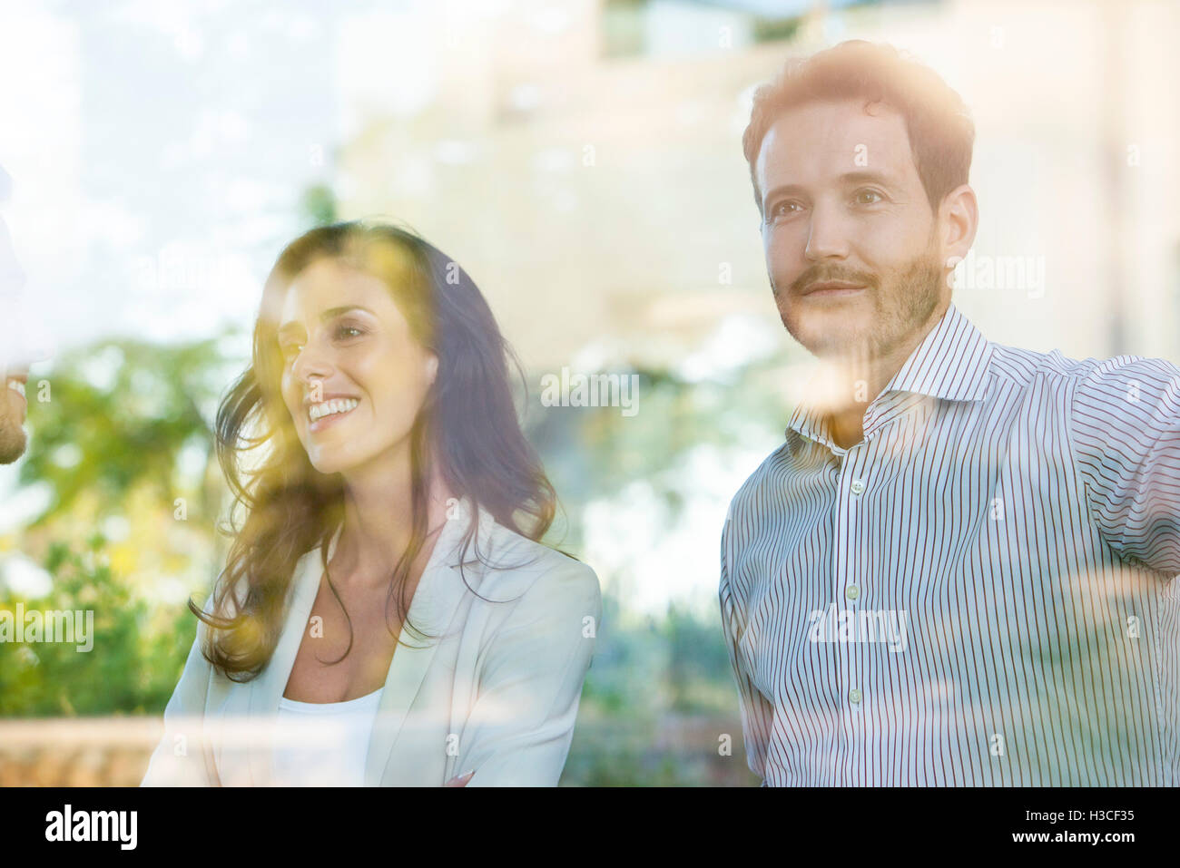 Businessman distracting during informal business meeting Stock Photo