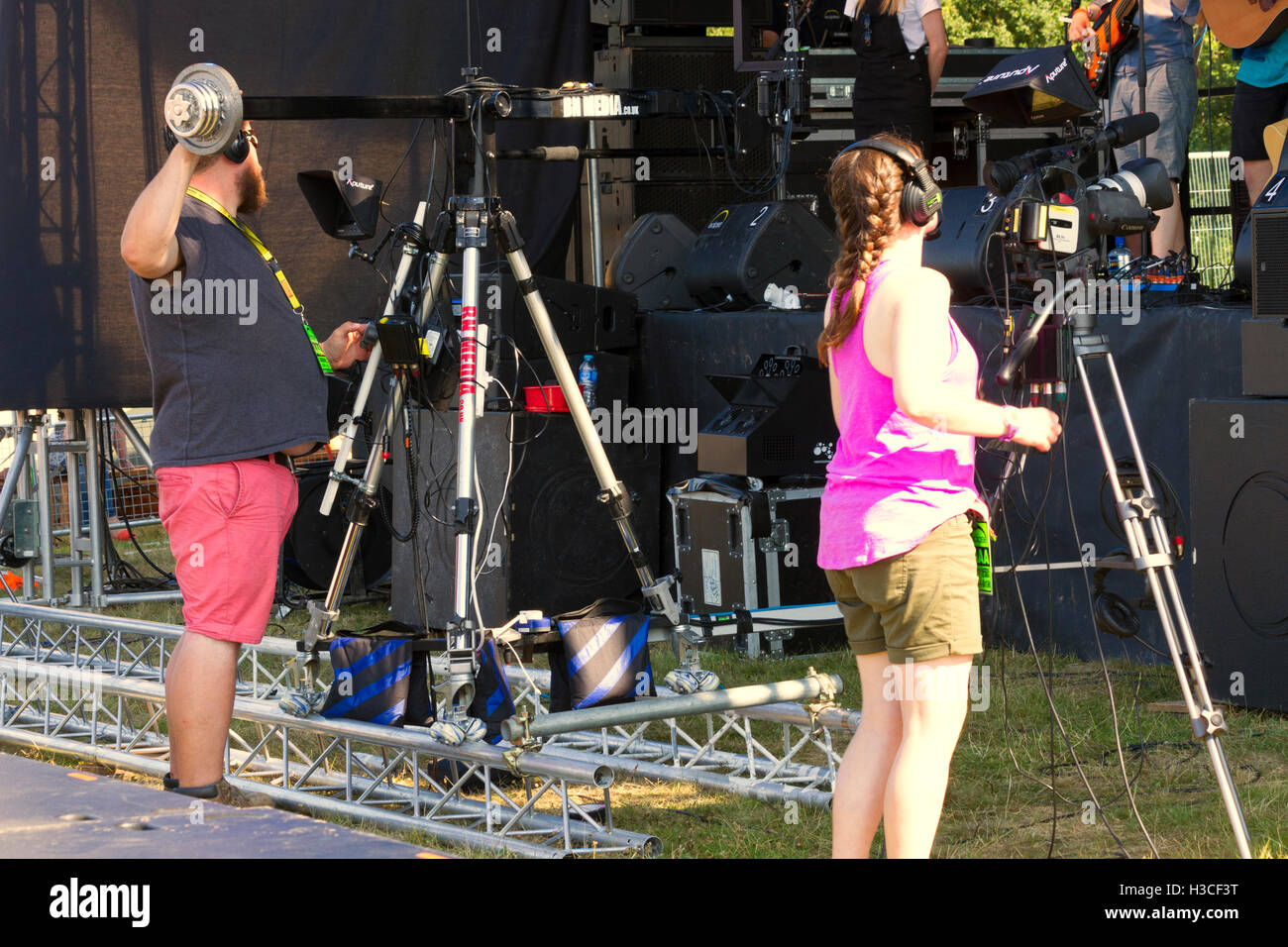 Film crew covering the annual Sausage and Beer Music Festival at Jimmy's Farm, Ipswich Suffolk, UK Stock Photo