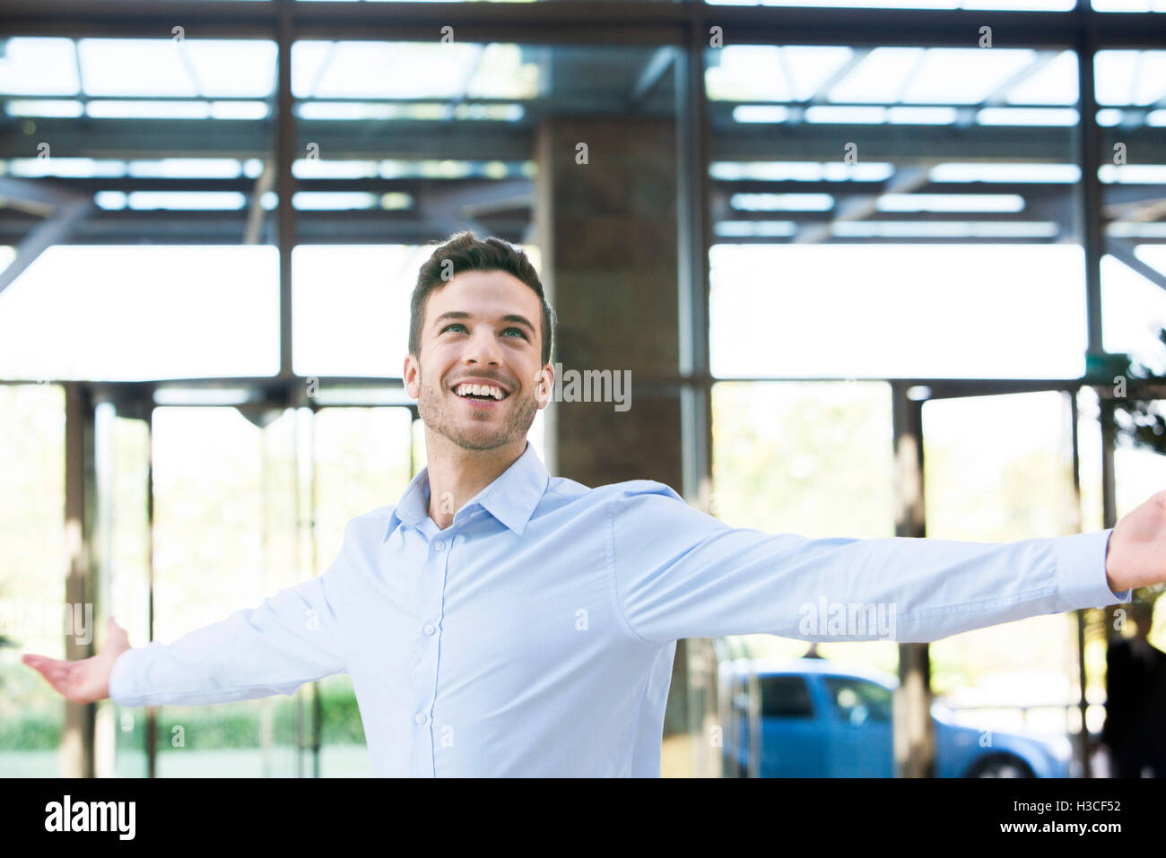 Man with outstretched arms Stock Photo
