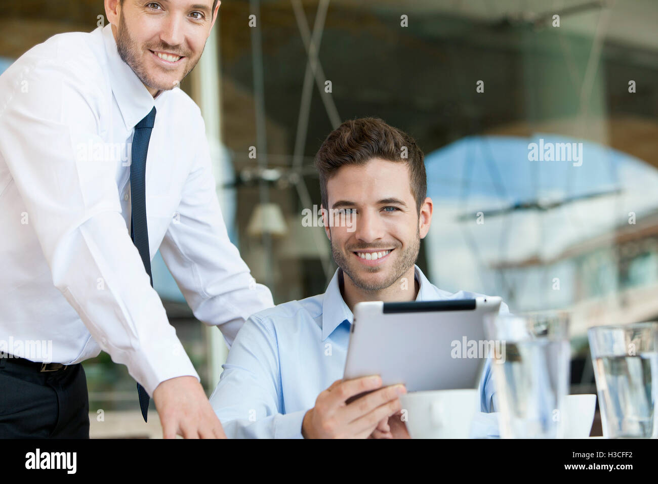 Business partners working together on digital tablet Stock Photo
