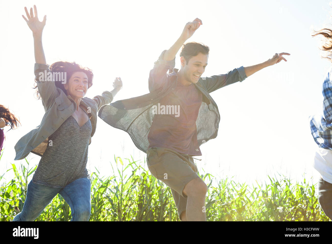 Young people leaping with exuberance Stock Photo