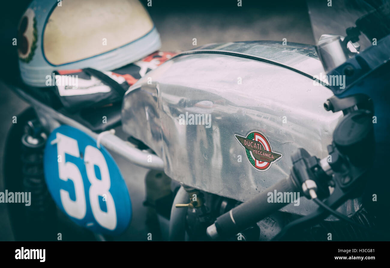 Vintage Ducati racing motorcycle and helmet. Vintage filter applied Stock Photo