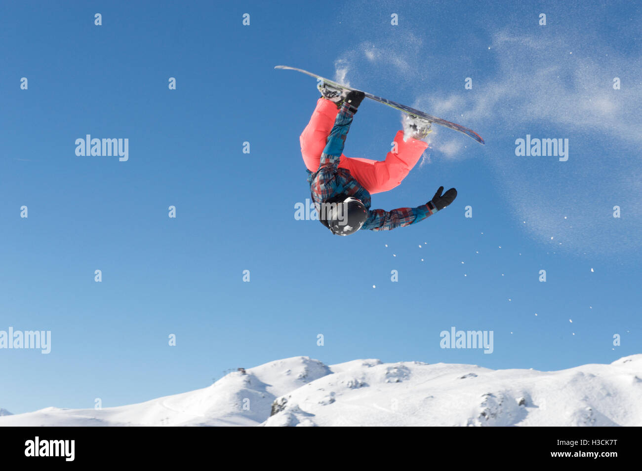Front loop with a snowboard Stock Photo