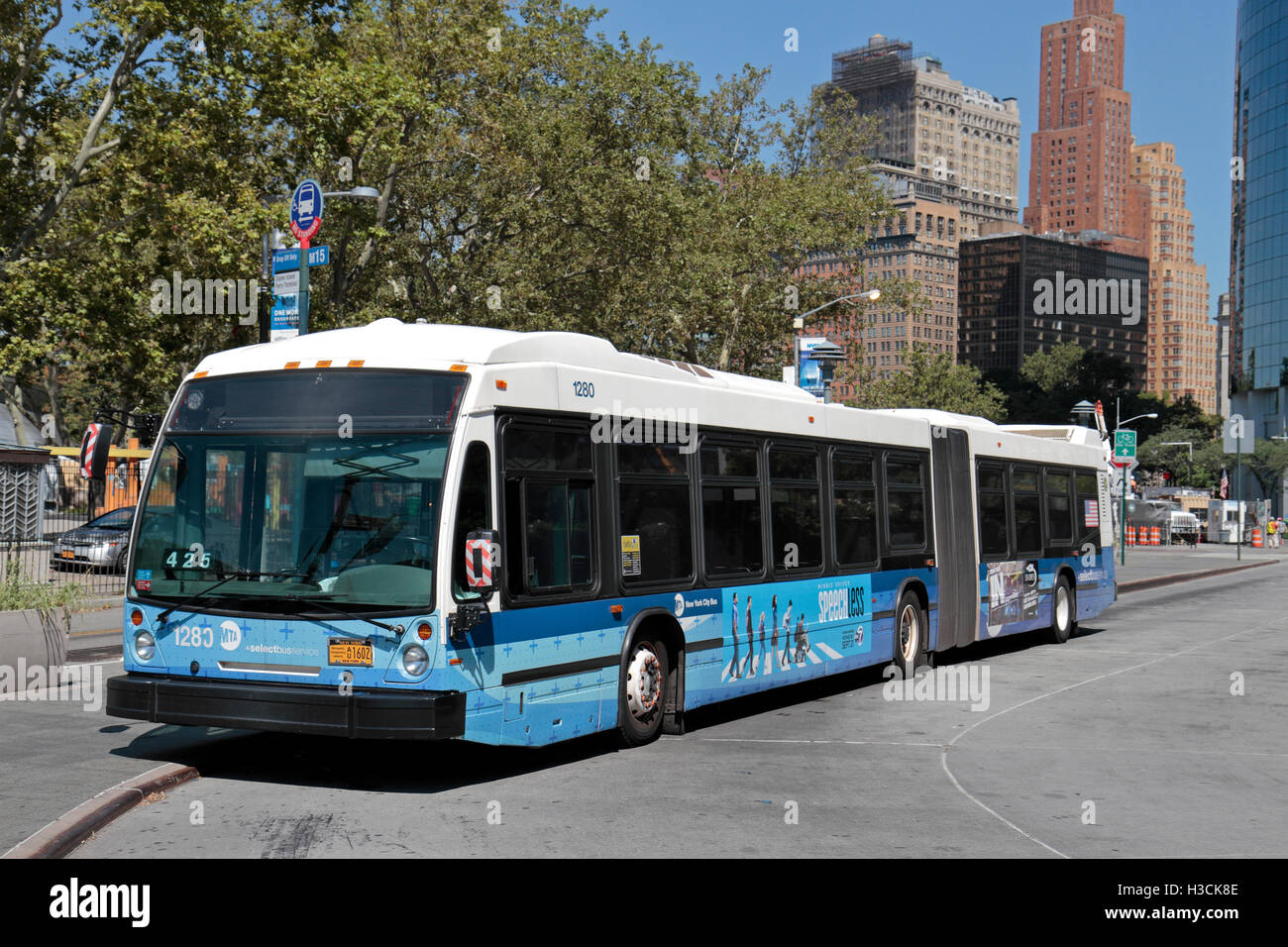 An MTA New York City bendy bus parked in Battery Park, Manhattan, New York, United States. Stock Photo