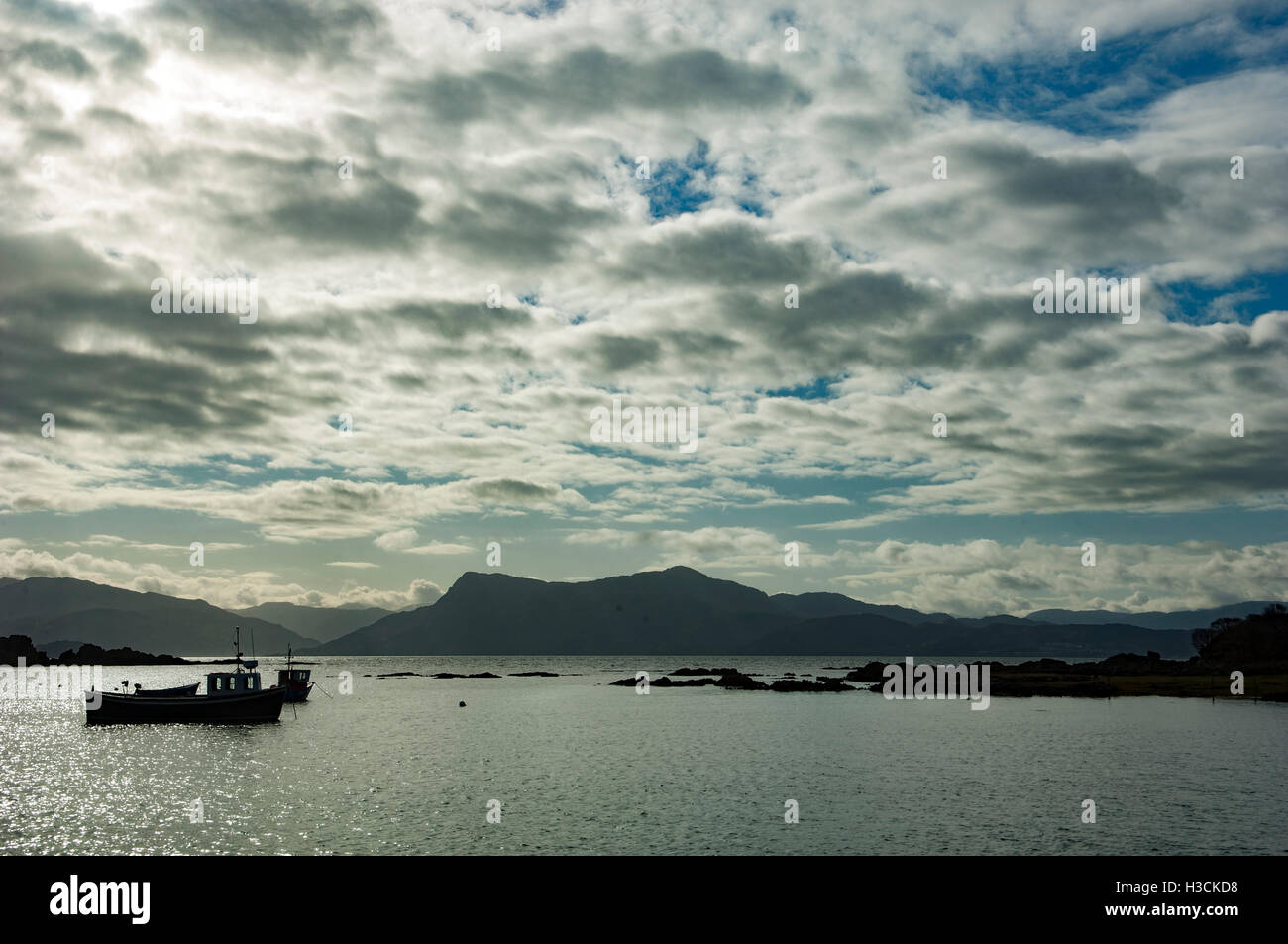 Fishing boat in silhouette Stock Photo - Alamy