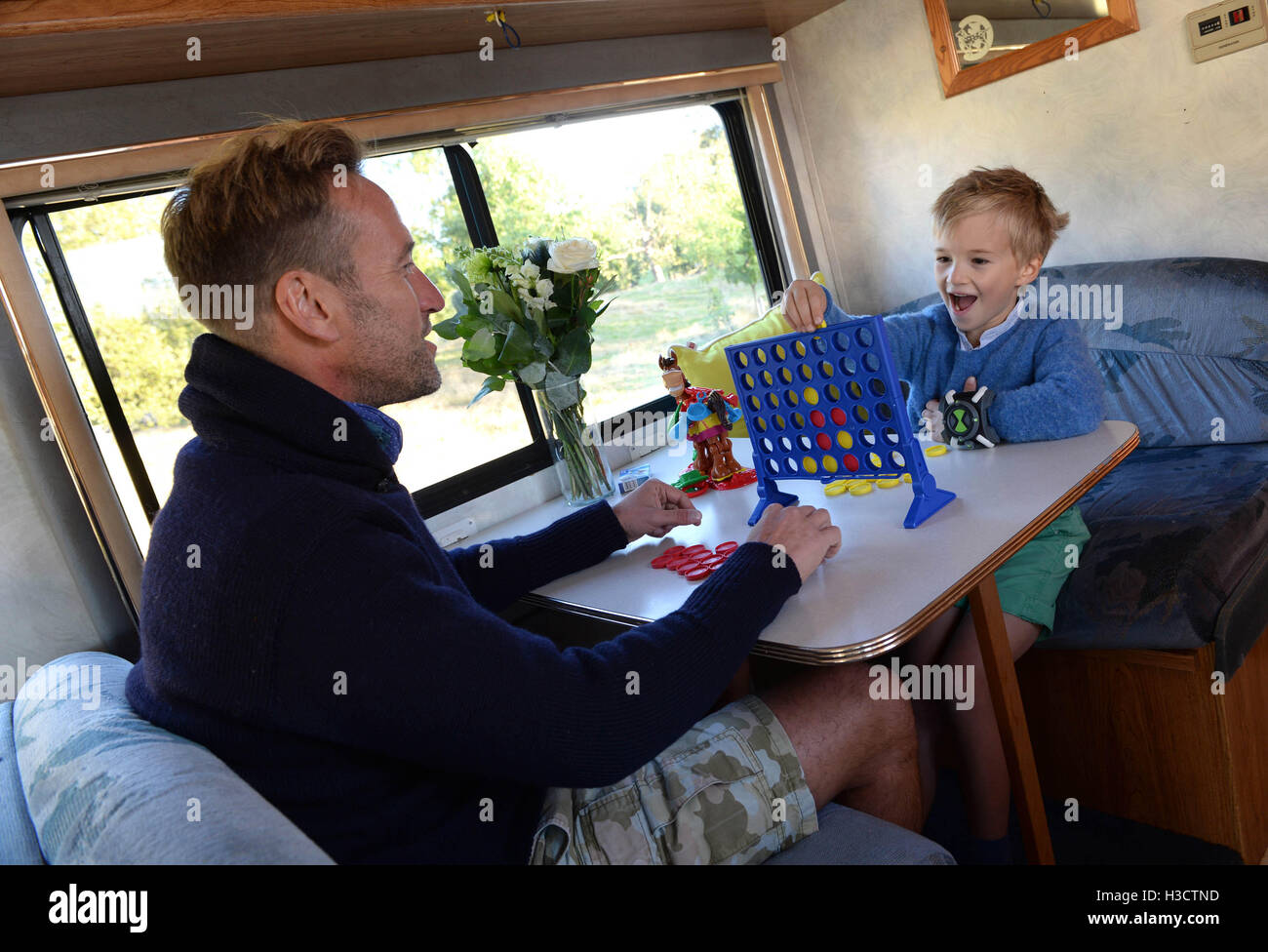 EDITORIAL USE ONLY Television presenter Ben Fogle and his son Ludo, six, launch Cartoon Network's Rust Bucket competition in partnership with Airbnb, for families to win a night's stay in a real-life replica of the motorhome that features in the animated series Ben 10, which returns to screens on Saturday 8th October at 10am. Stock Photo