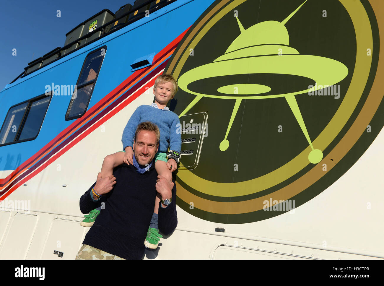 EDITORIAL USE ONLY Television presenter Ben Fogle and his son Ludo, six, launch Cartoon Network's Rust Bucket competition in partnership with Airbnb, for families to win a night's stay in a real-life replica of the motorhome that features in the animated series Ben 10, which returns to screens on Saturday 8th October at 10am. Stock Photo