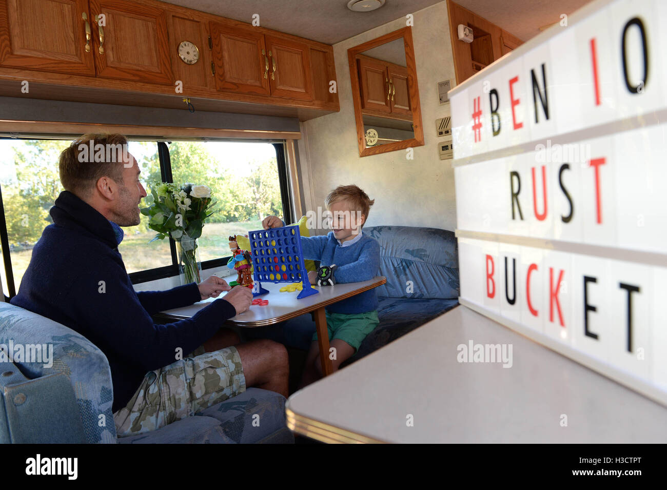 EDITORIAL USE ONLY Television presenter Ben Fogle and his son Ludo, six, launch Cartoon Network's Rust Bucket competition in partnership with Airbnb, for families to win a night's stay in a real-life replica of the motorhome that features in the animated series Ben 10, which returns to screens on Saturday 8th October at 10am. Stock Photo