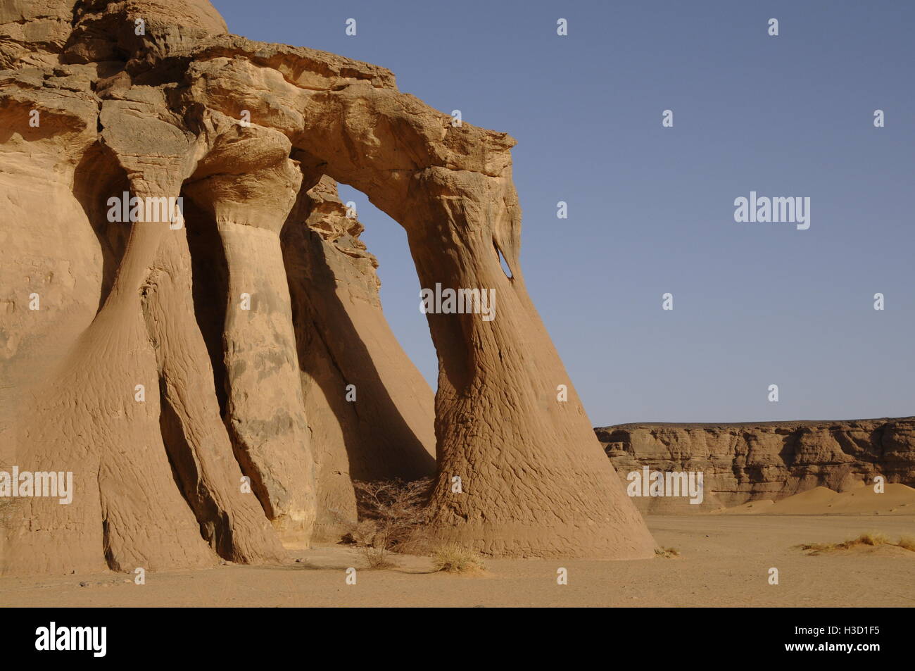 The incredible rock formation Tinhaliga Arch, Acacus Mountains, Sahara Desert, Libya Stock Photo