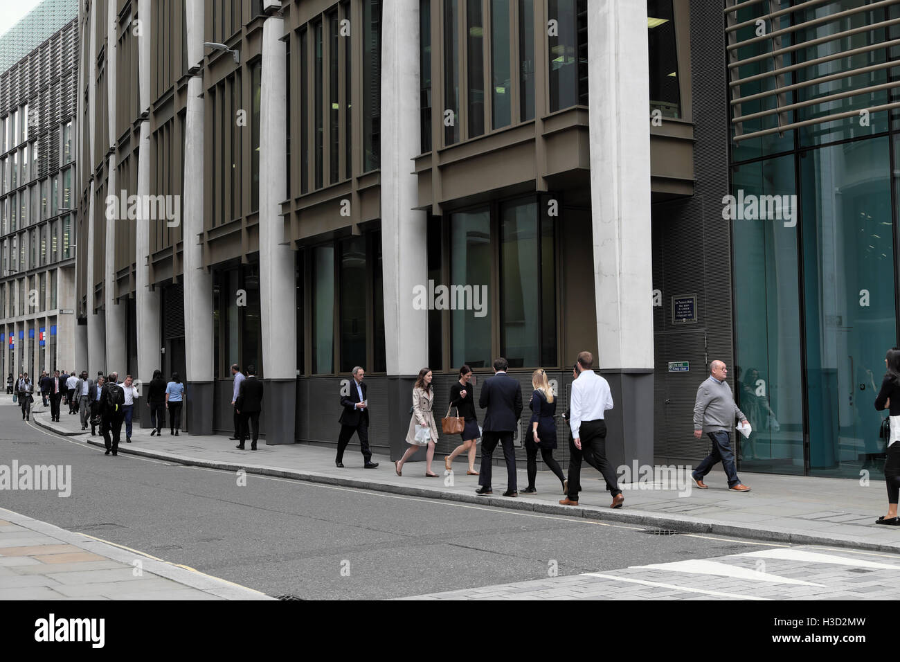 Office workers business people walking along Milk Street near Gresham Street at lunchtime in the City of London UK  KATHY DEWITT Stock Photo
