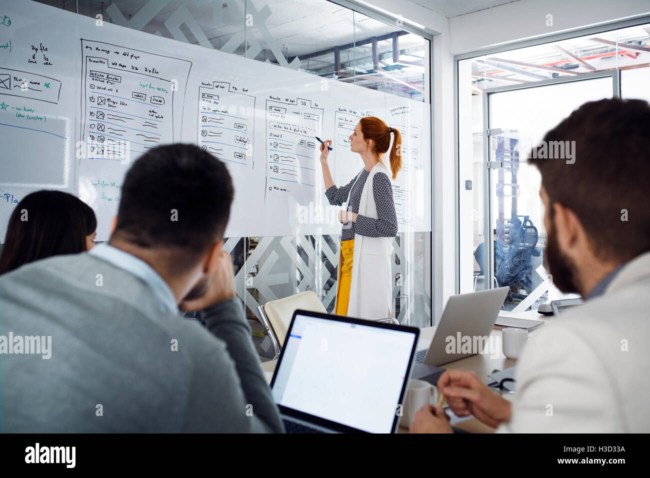 Businesswoman explaining creative strategy hi-res stock photography and ...