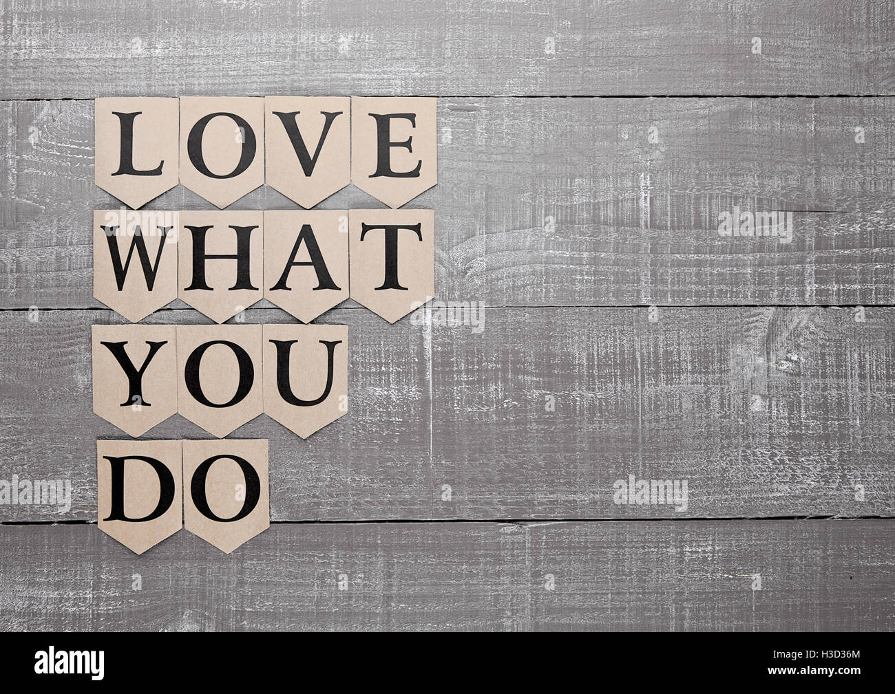 love what you do motivation symbol on wooden board Stock Photo