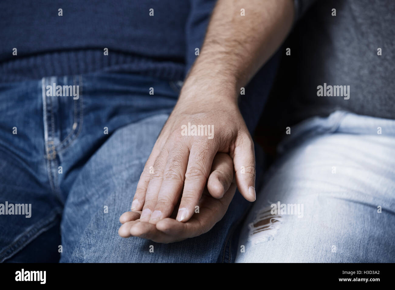 Two indian men holding hands hi-res stock photography and images - Alamy