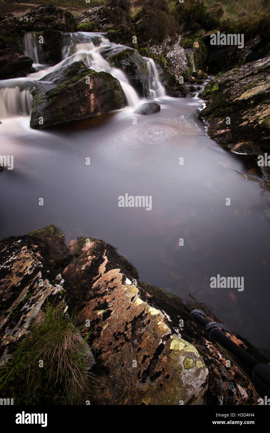 High angle view of water flowing through rocks into river Stock Photo ...