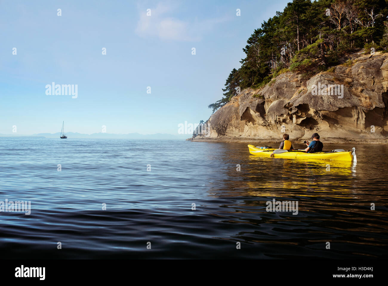 Rear view of men kayaking at Strait of Stock Photo Alamy
