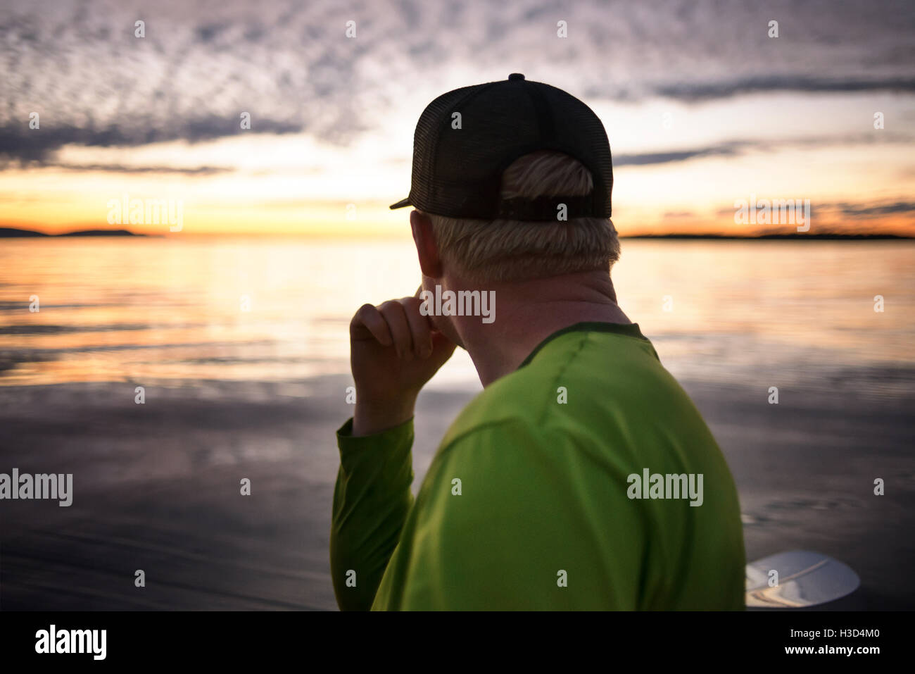 Side view of thoughtful man at Sucia Island during sunset Stock Photo