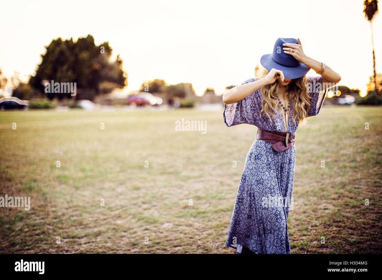 Woman walking wearing hat hi-res stock photography and images - Alamy