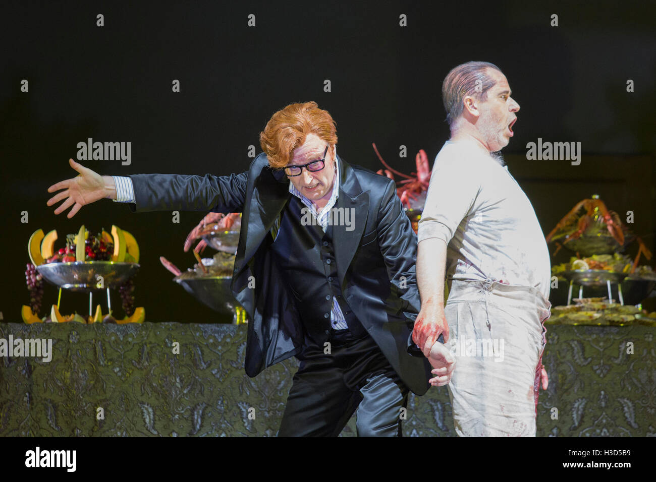 London, UK. 28 September 2016. Pictured: Clive Bayley and James Creswell. Dress rehearsal of the Mozart opera Don Giovanni at the London Coliseum. The English National Opera production directed by Richard Jones runs for 9 performances from 30 September to 26 October 2016. With Christopher Purves as Don Giovanni, Clive Bayley as Leporello, Caitlin Lynch as Donna Anna, Allan Clayton as Don Ottavio, Christine Rice as Donna Elvira, James Creswell as Commendatore, Mary Bevan as Zerlina and Nicholas Crawley as Masetto. Stock Photo
