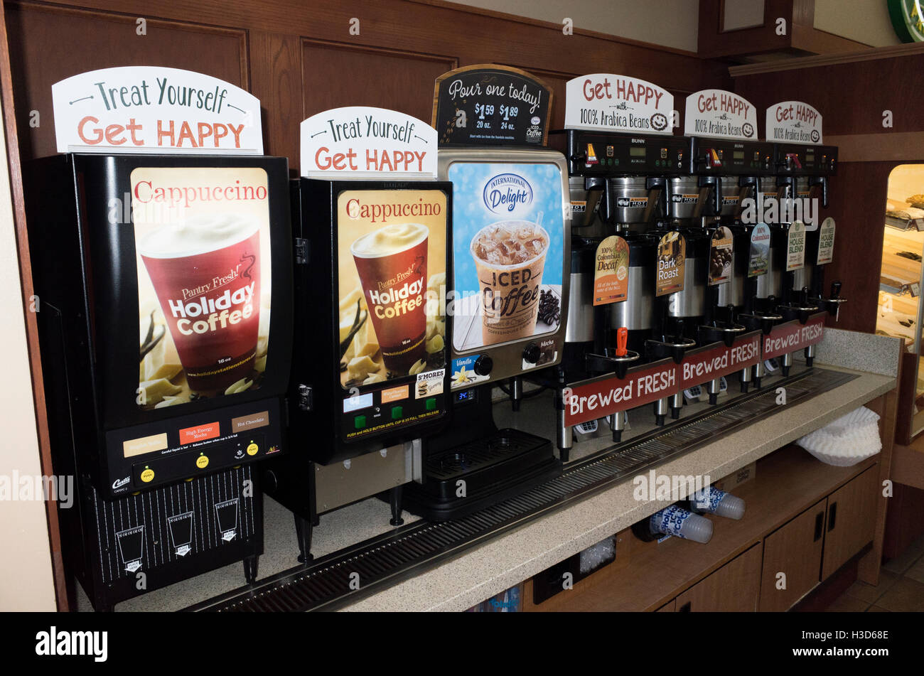 Long row of convenience store coffee dispensers featuring many flavors. Freeway 94 Minnesota MN USA Stock Photo