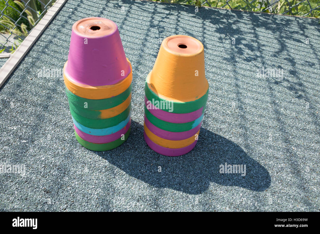 Two stacks of pastel clay pots for growing plants. Minneapolis Minnesota MN USA Stock Photo