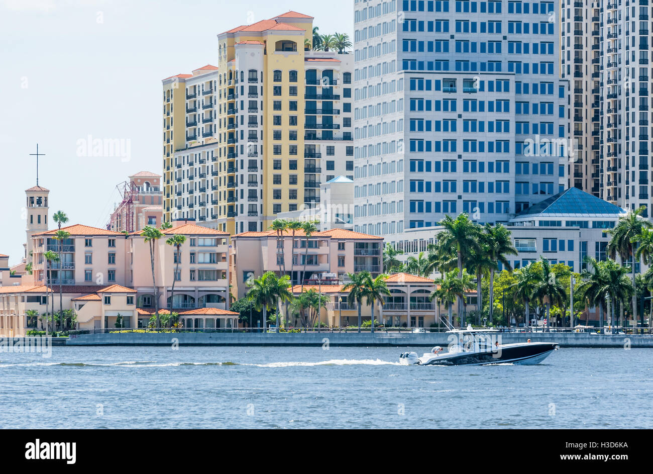 West Palm Beach, Florida, waterfront with boaters crossing in front of Palm Beach Atlantic University. (USA) Stock Photo