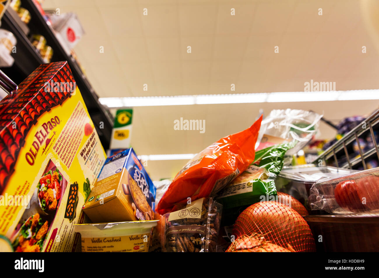 Groceries in shopping cart in supermarket trolley food shopping in trolley shop store grocers